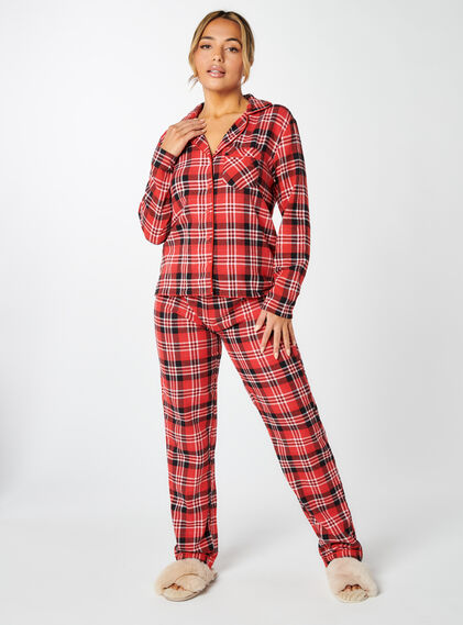 Red and black check pyjamas in a bag