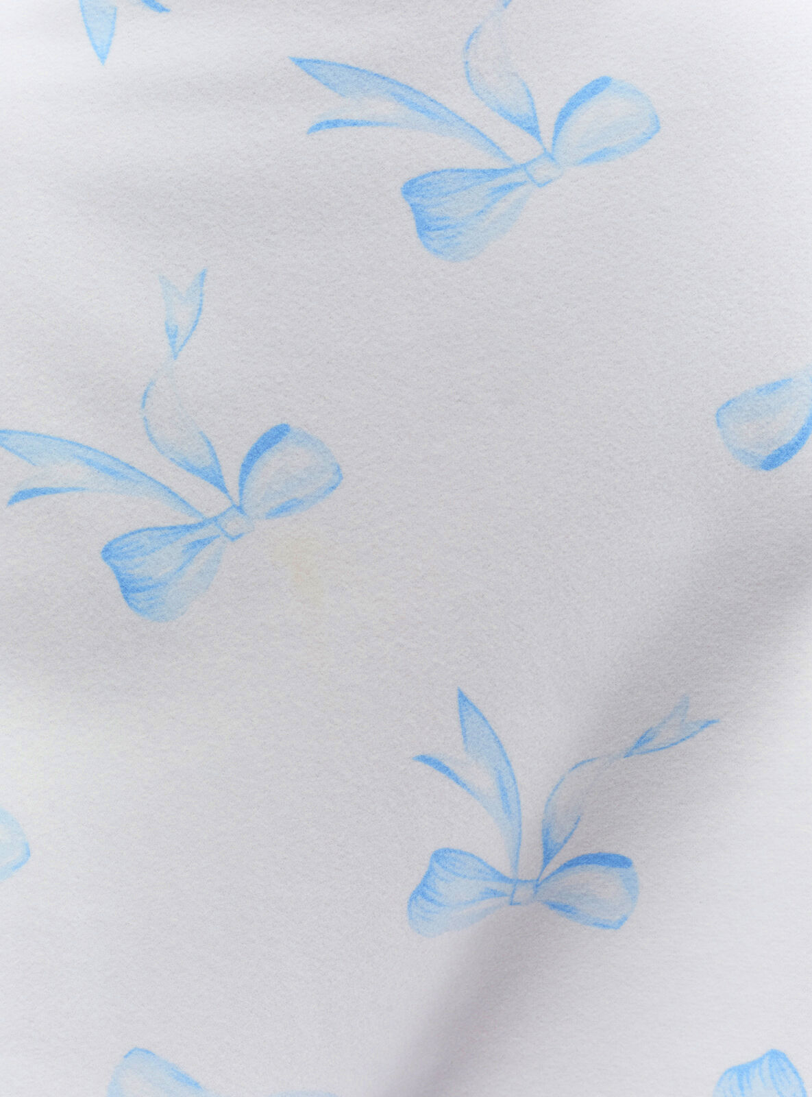 Bow print pyjamas in a bag