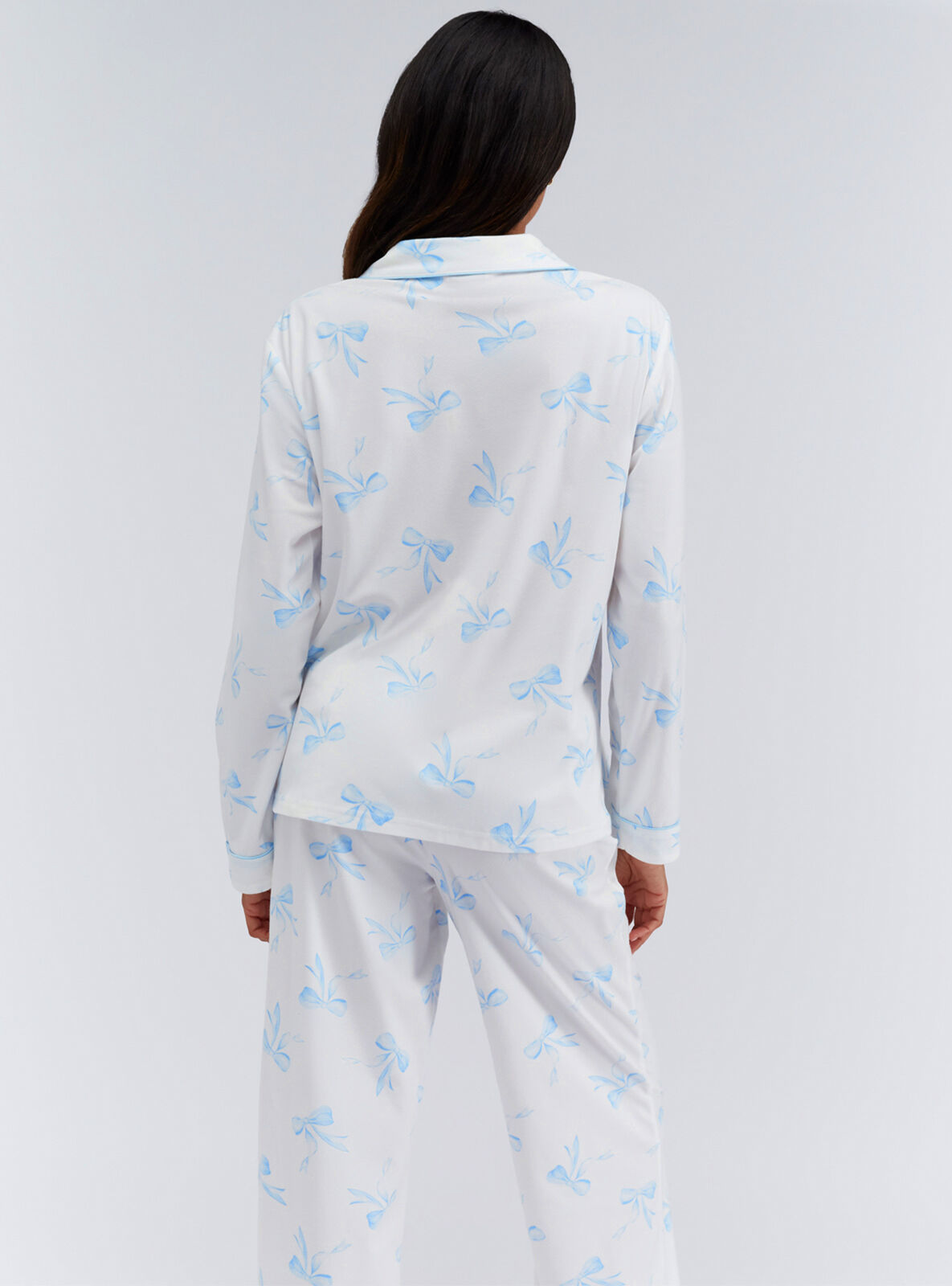 Bow print pyjamas in a bag