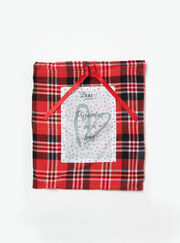 Red and black check pyjamas in a bag