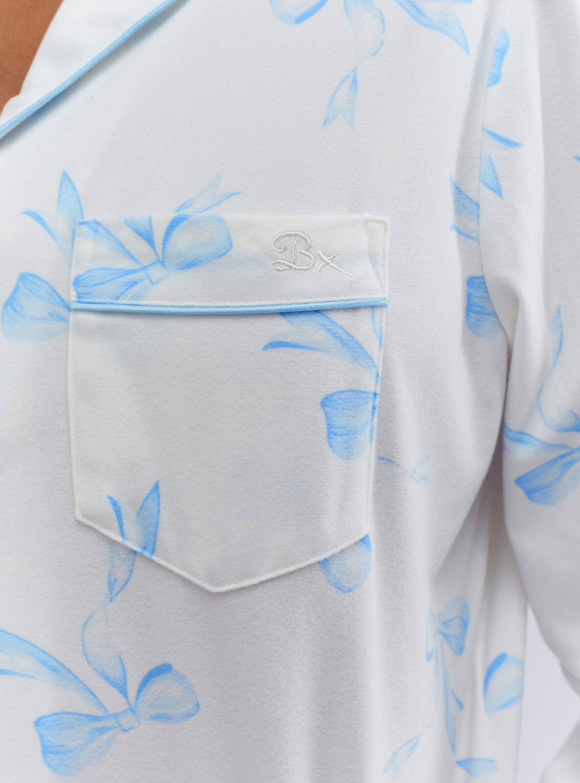 Bow print pyjamas in a bag