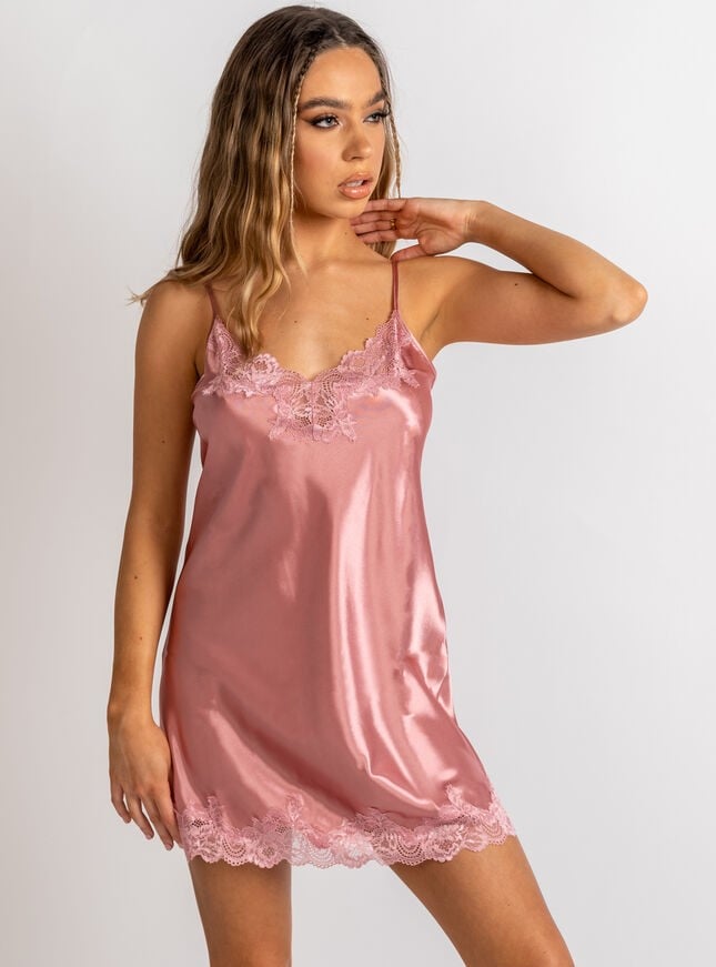 Woman wearink satin chemise 