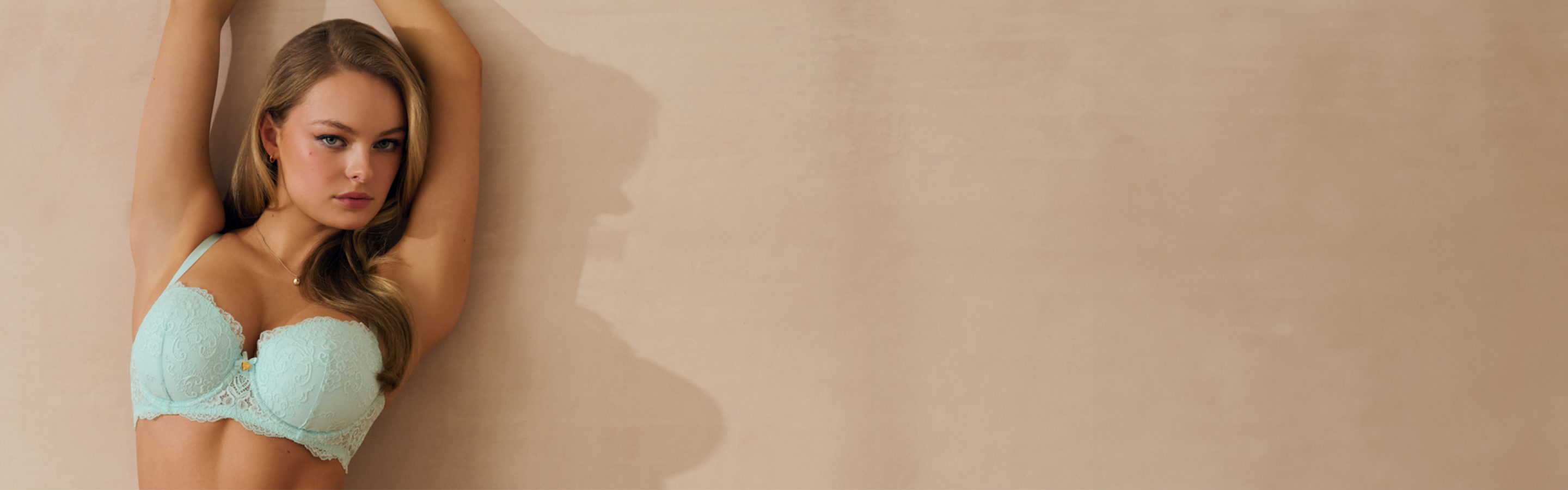 Woman in mint green lingerie set