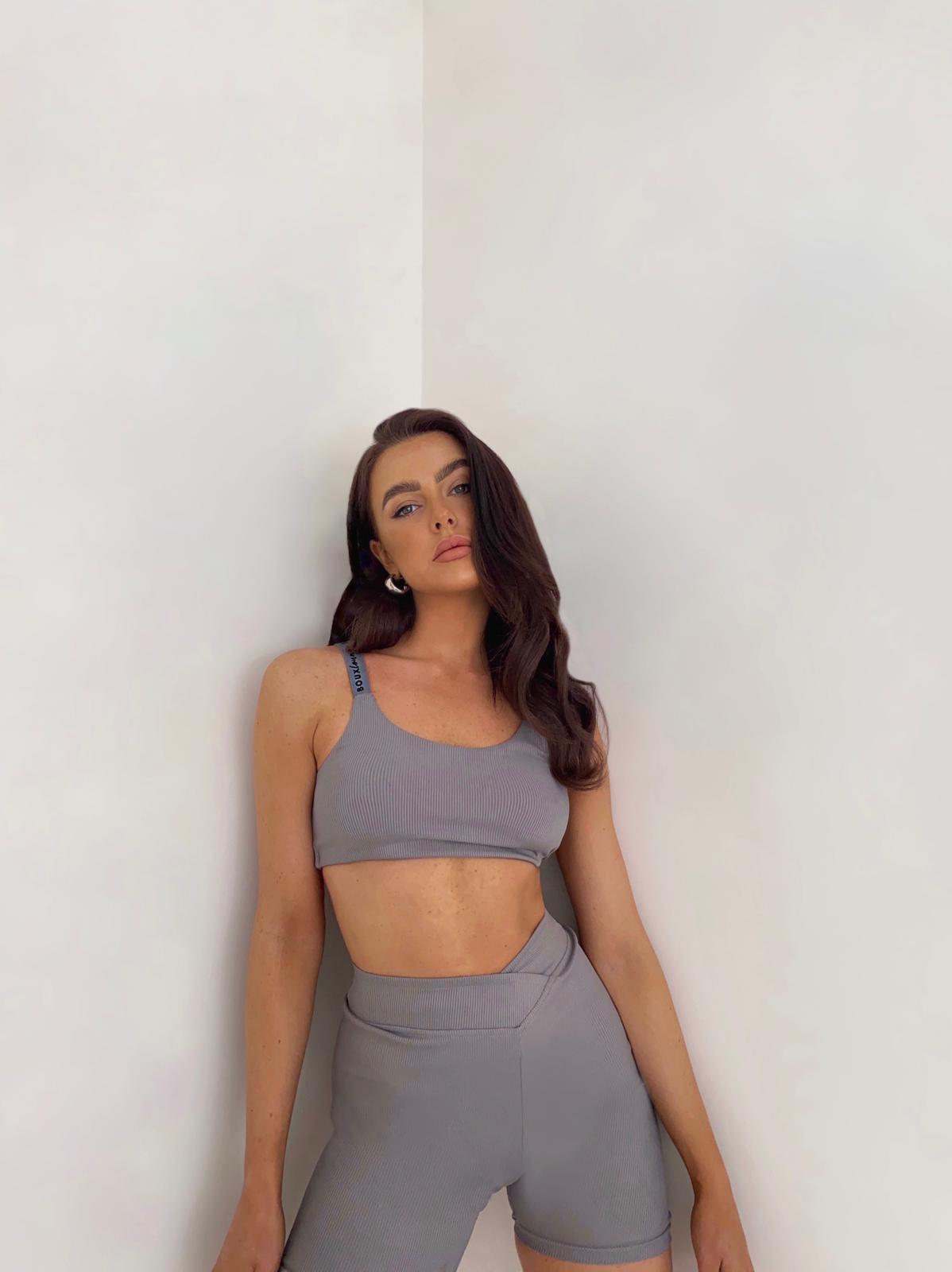 woman wearing grey cycling shorts set 
